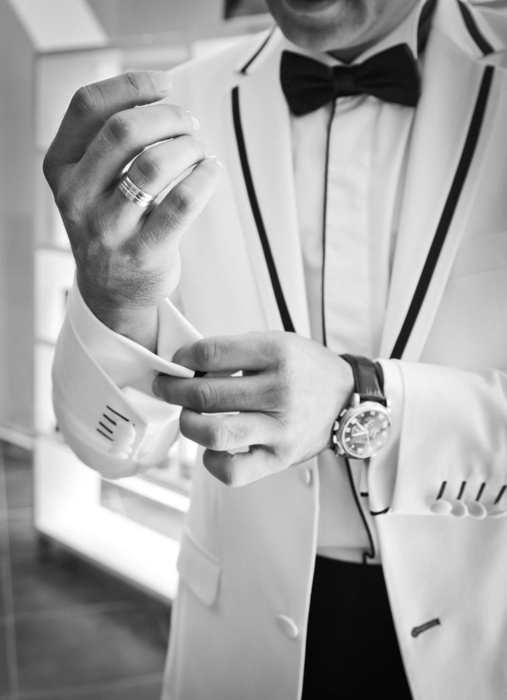 Bespoke charcoal tuxedo, cufflink detail with bow tie